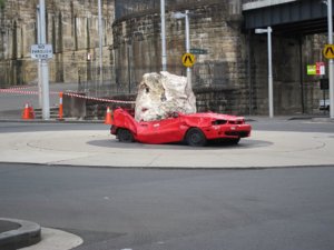 1024px-Crushed_car_art_at_roundabout.jpg