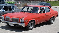 1973_Oldsmobile_Omega_Town_Sedan_in_Omega_Red_Front_Left_05-29-2022.jpg